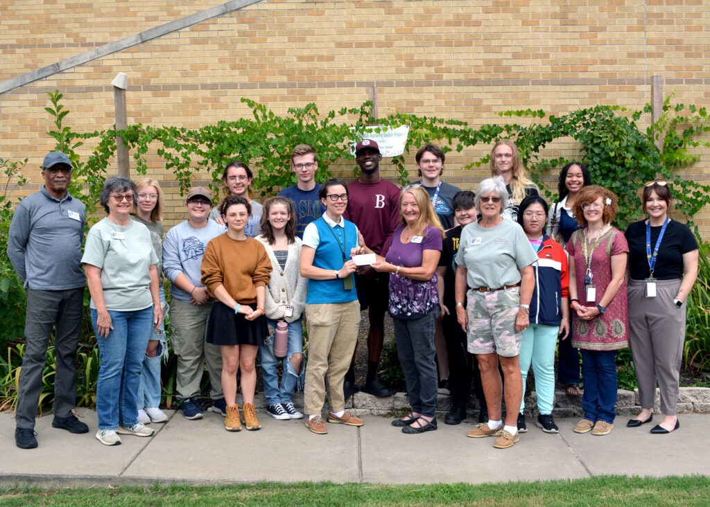 group accepting grant check for native pollinator garden