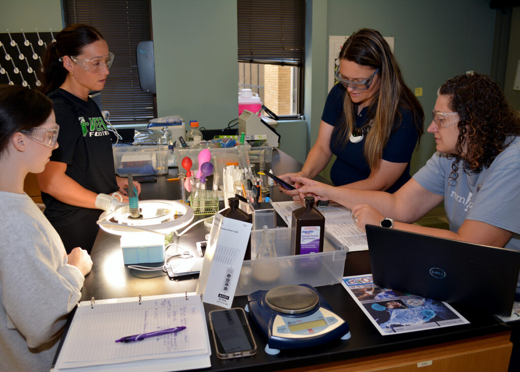 photo of educators conducting a biology lab experiment