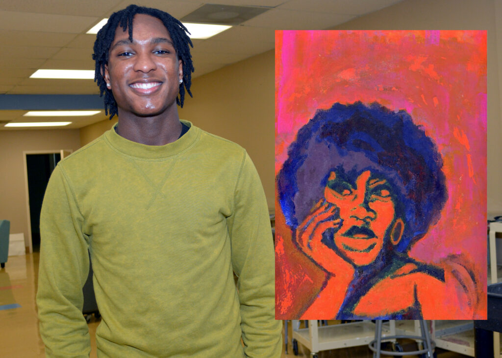 Student Preston Lowe with painting